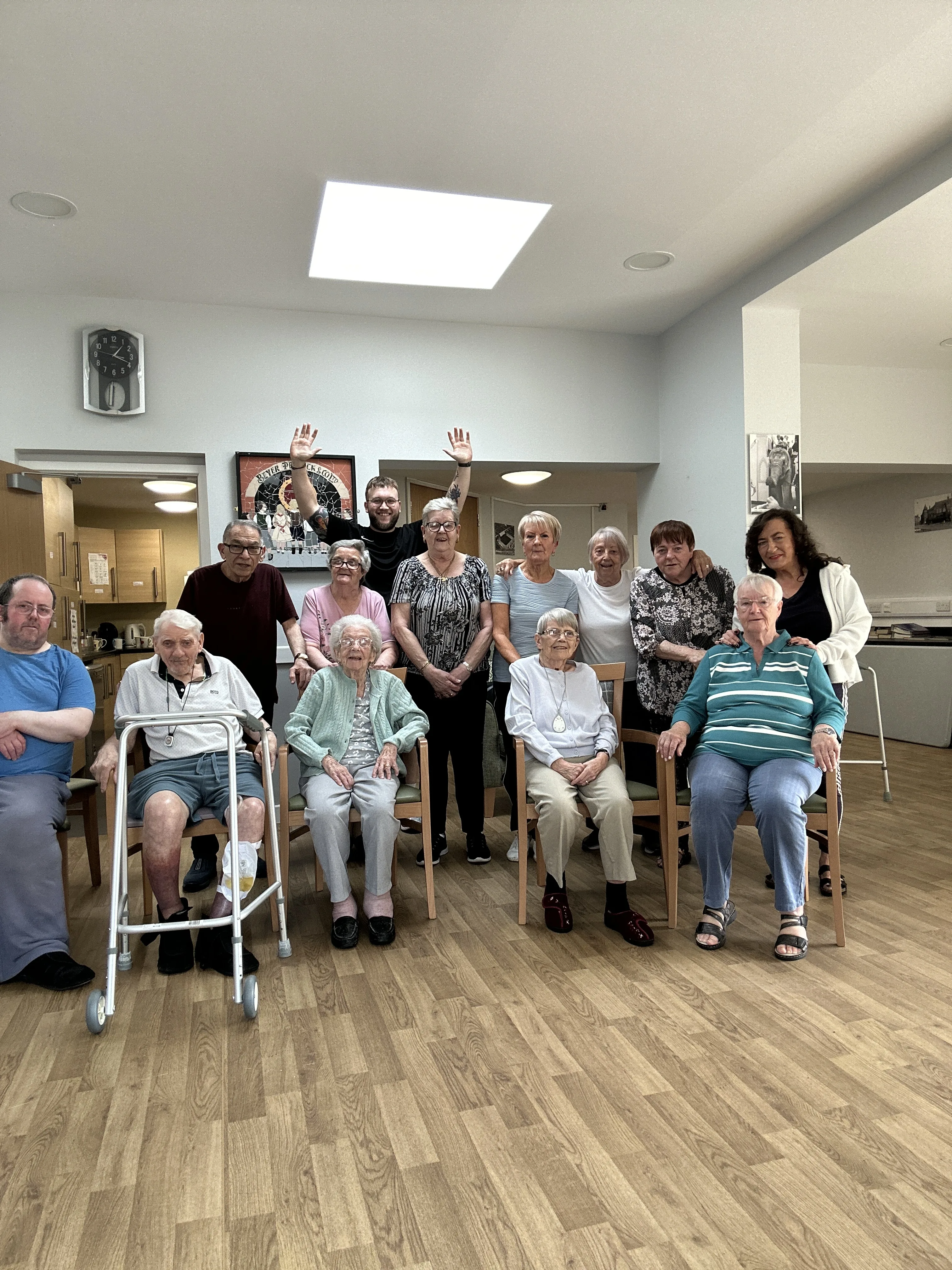 Kallum running a group chair-based exercise session with older adults